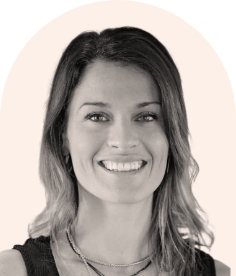 Smiling woman with medium-length hair wearing necklace
