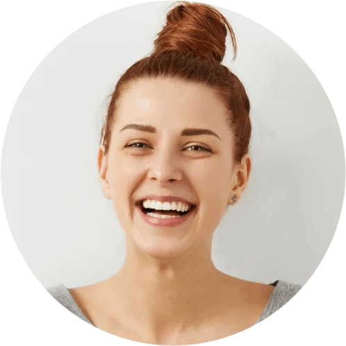 Smiling young woman with hair in a bun