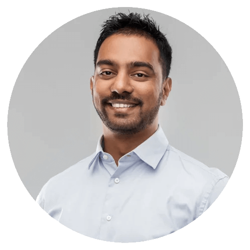 Smiling man in light shirt with short dark hair